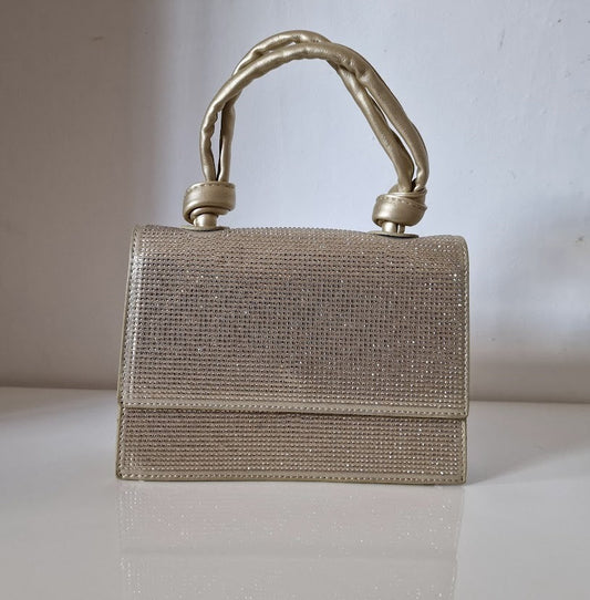 diamante knot handle gold clutch bag