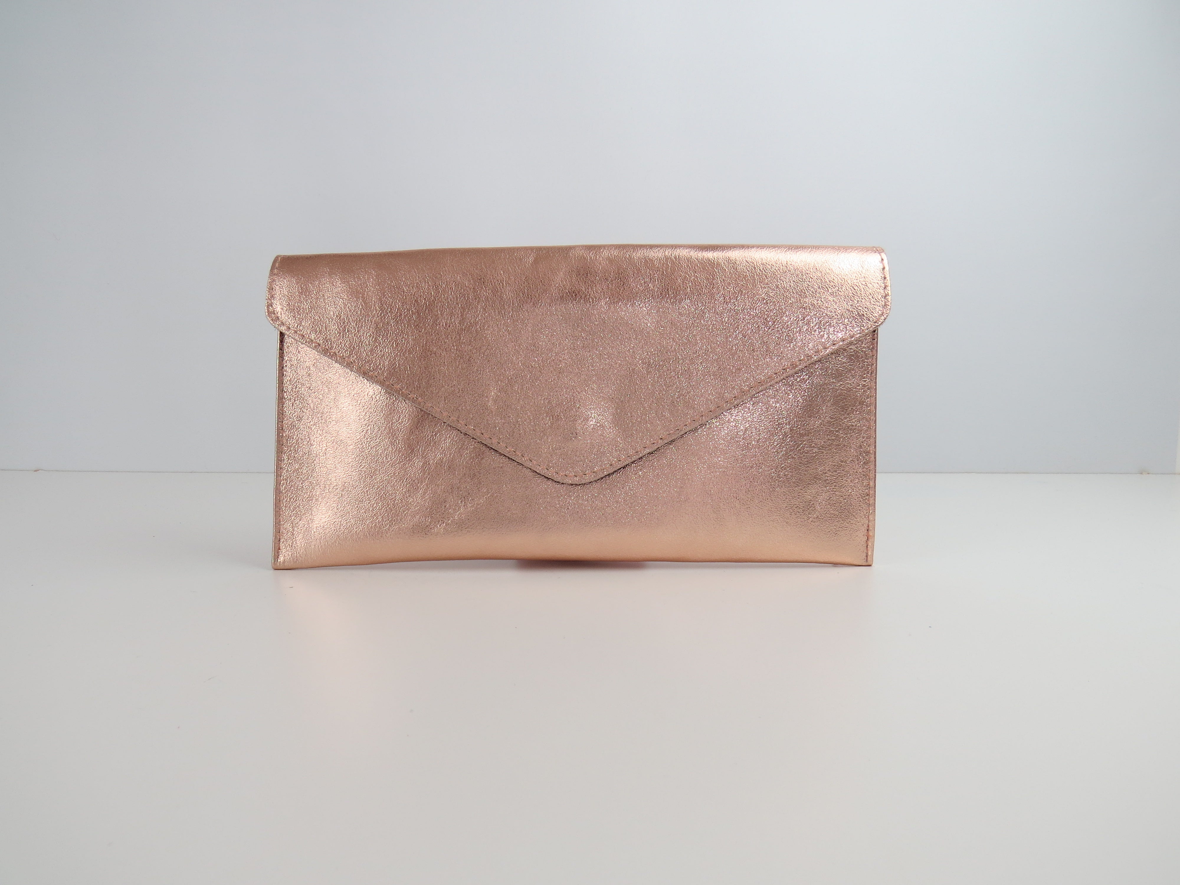 Rose gold leather clutch sale bag