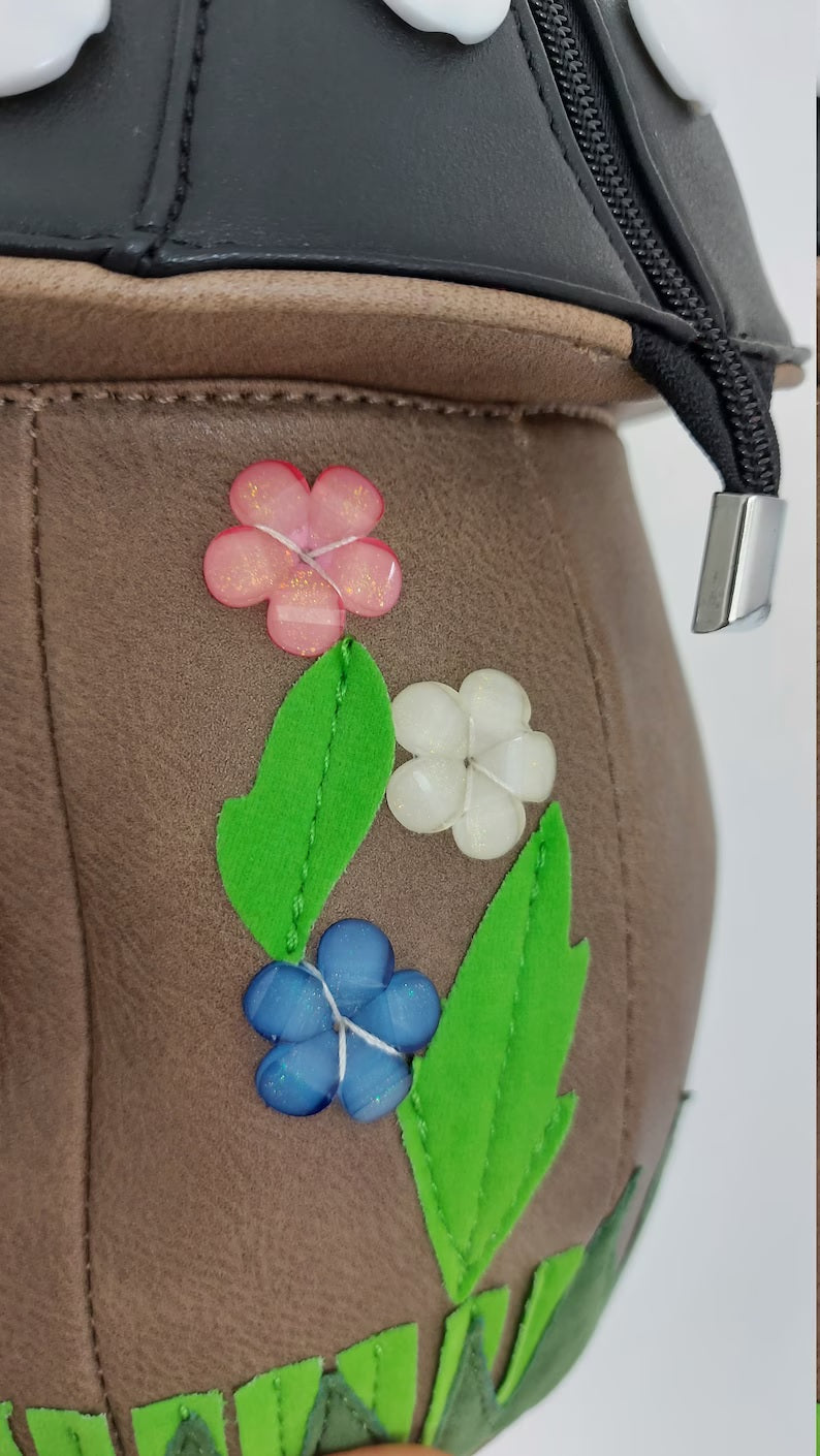 flower design on black mushroom handbag